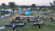 تصوير جوي لفعالية خارجية نظمتها Experiume في الرياض، جلسات ضيافة تحت أشجار النخيل